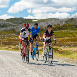Three road cyclists riding the Bogan High Plains road